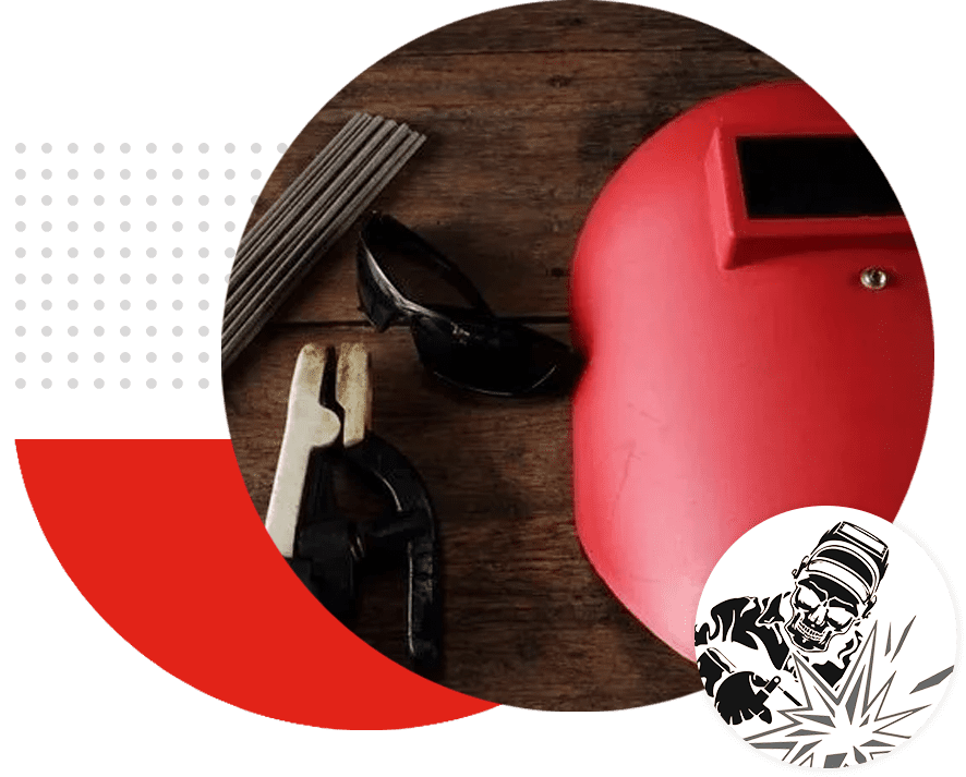 A red welding helmet with a pair of scissors and a pair of scissors.