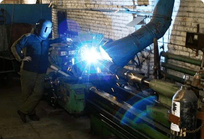 A man working on a machine in a factory.