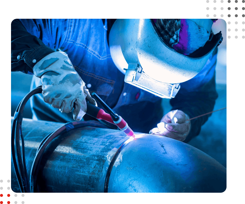 A welder working on a pipe.